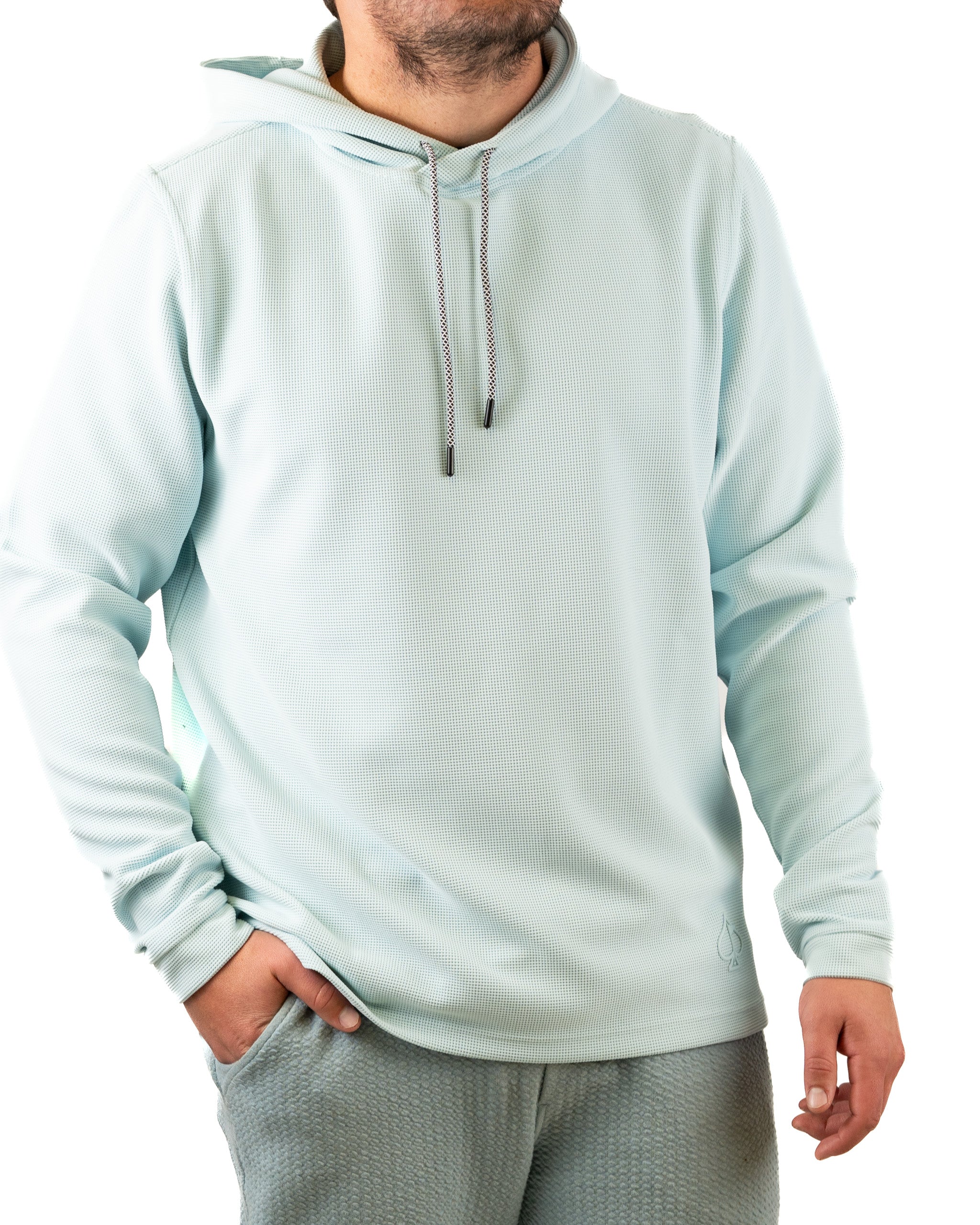 Light blue waffle grid hoodie with a relaxed fit, featuring a drawstring hood and a subtle logo on the front.