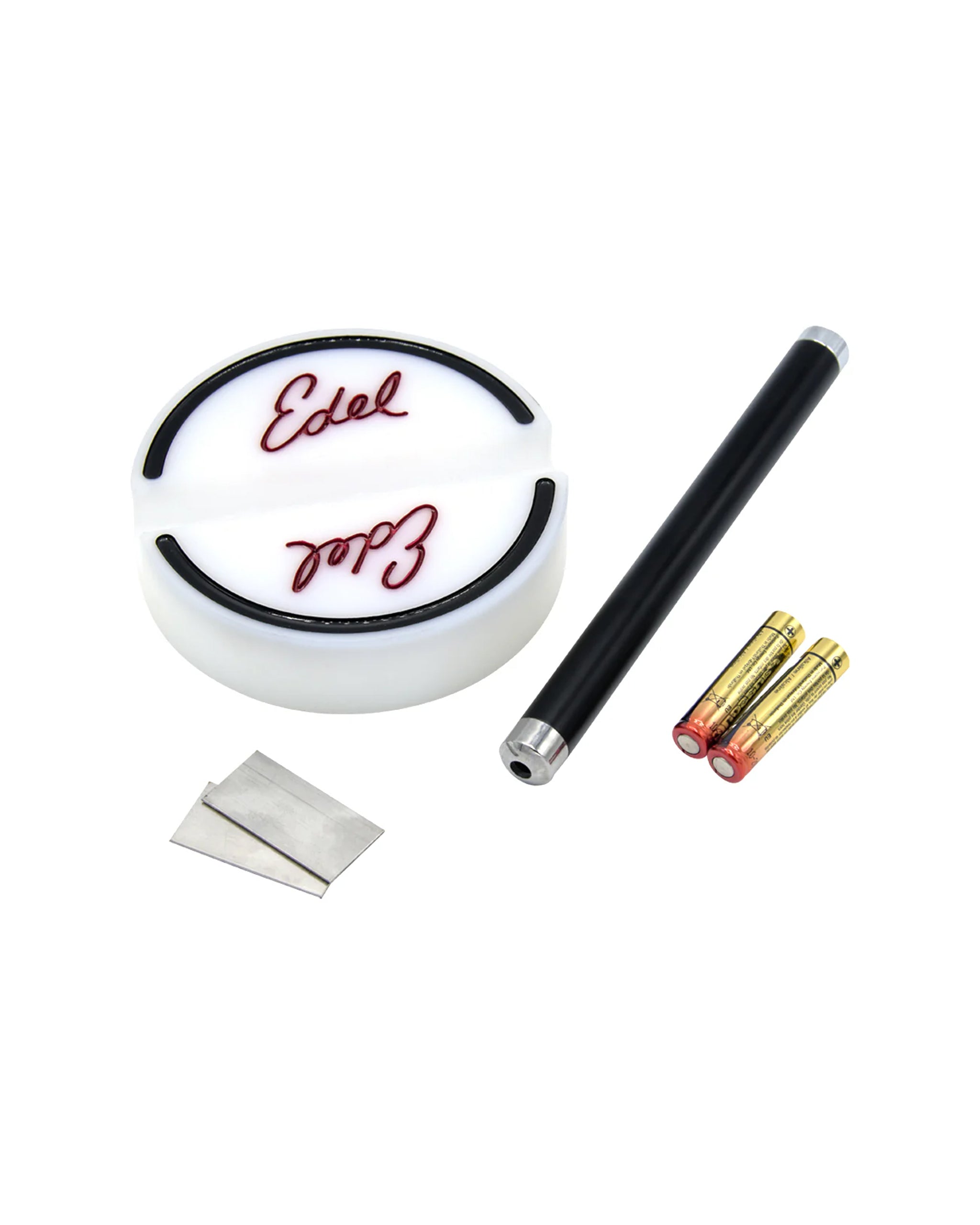 Aim Check alignment tool set with a circular base, alignment rod, batteries, and replacement blades for golfers.