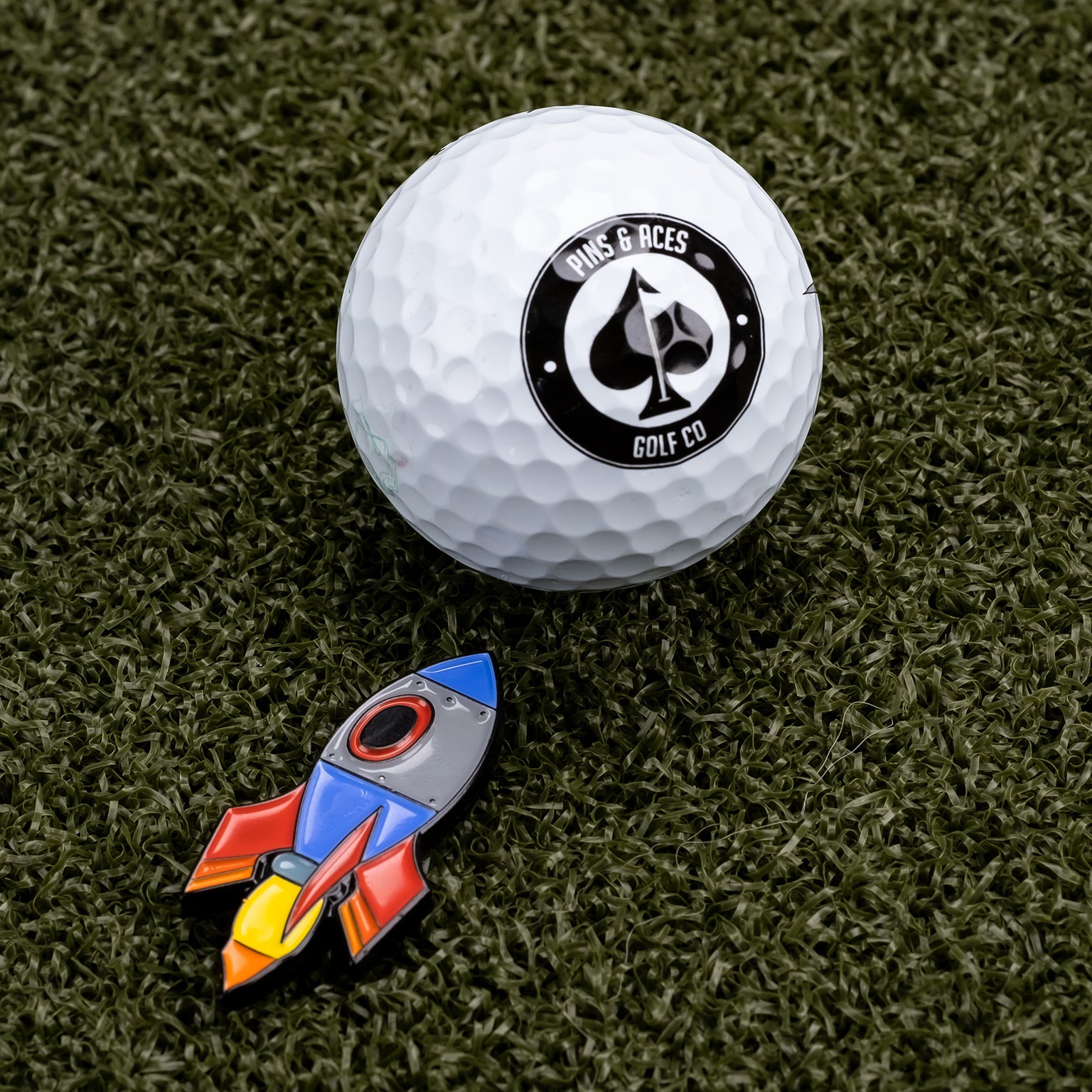 Pins & Aces Rocket Emoji Ball Marker: Bring Fun to Your Game